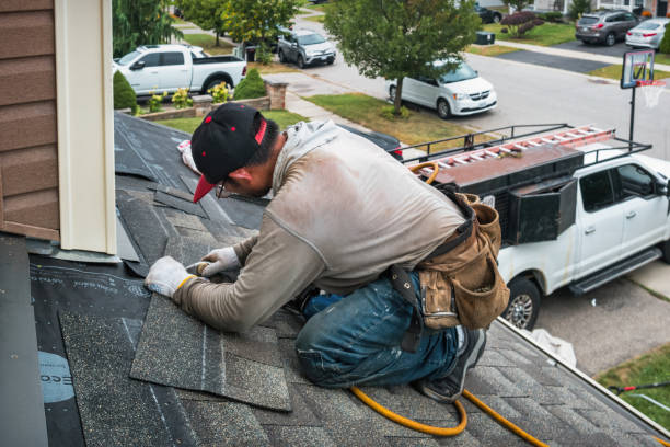 Professional Roofing technician working in North Marshfield, MA